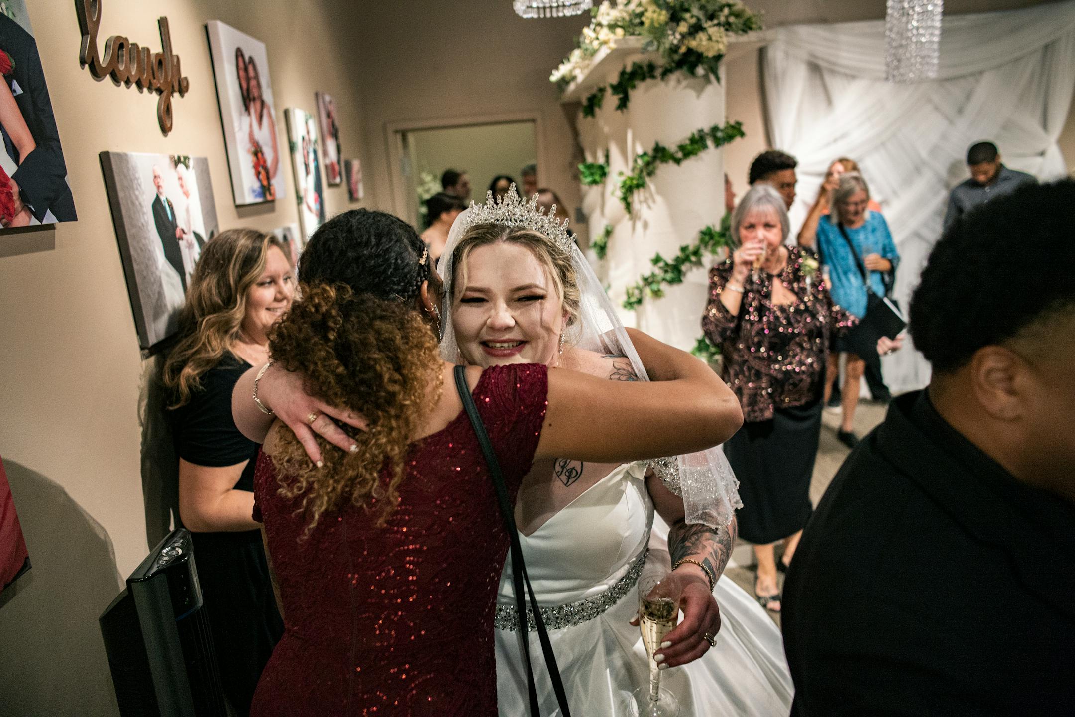 Andrea Price gets a hug after being married at Chapel of Love on the last day.