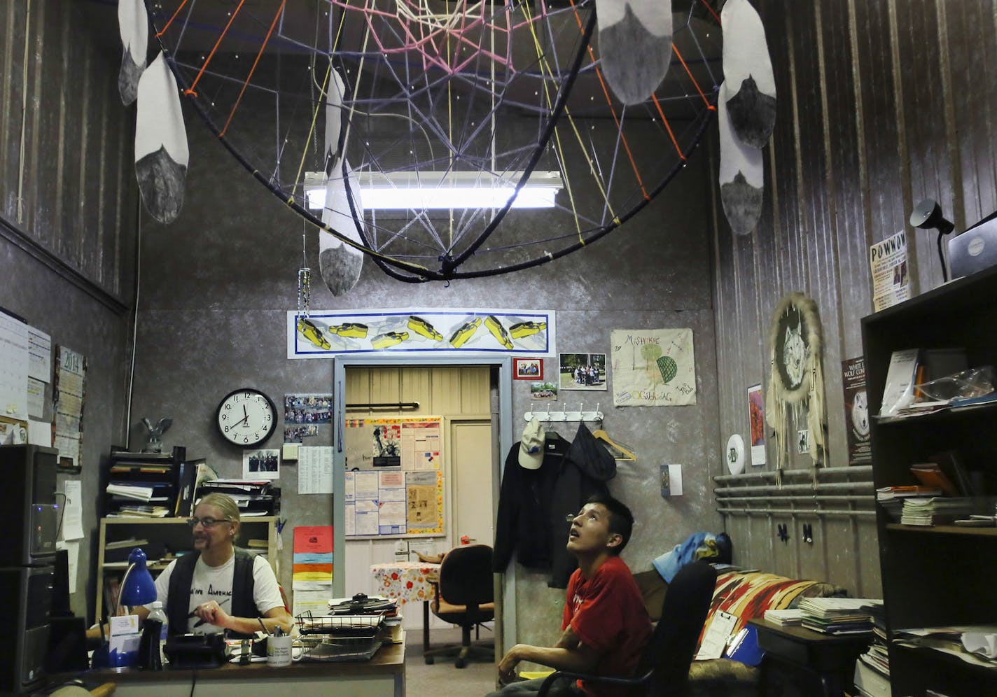 Randall Kingbird, a junior at Bug-O-Nay-Ge-Shig High School, sits in the office of counselor Jay Malchow. The school was once a pole shed used for maintaining vehicles before being turned into a high school that some refer to it as a "tin can".](DAVID JOLES/STARTRIBUNE)djoles@startribune The Bug O Nay Ge Shig School is a culturally based alternative school that opened in 1975 with a mission of serving Ojibwe children and has matured into a fully accredited educational program. Bug School is amon