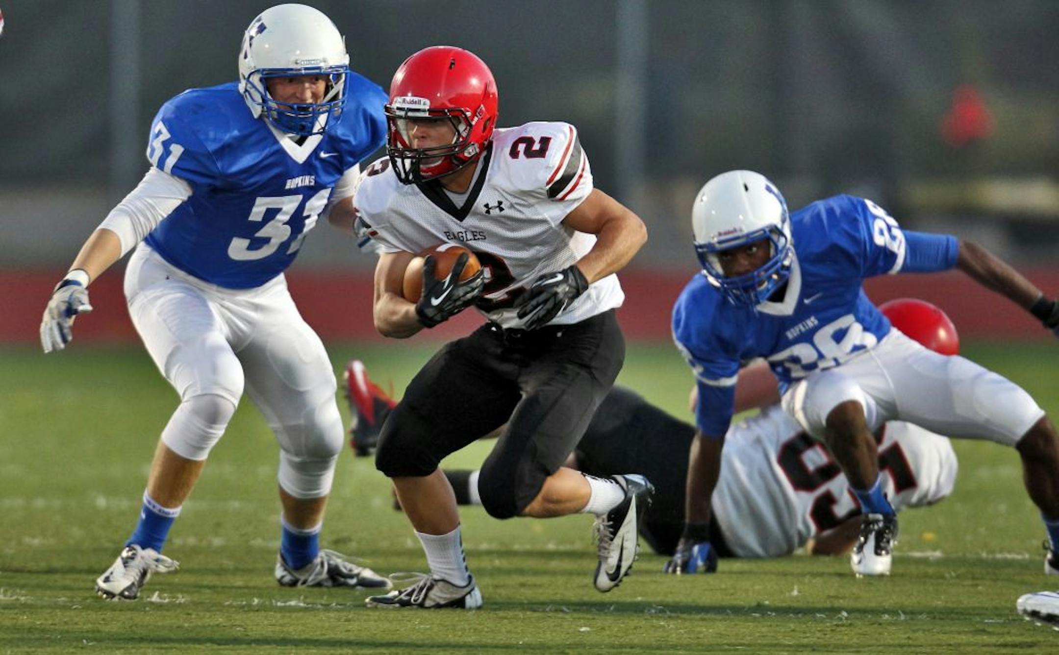 Prep football - Eden Prairie vs. Hopkins. Eden Prairie Charlie Venable (2) picked up first half yards as he left Hopkins tacklers behind. (MARLIN LEVISON/STARTRIBUNE(mlevison@startribune.com