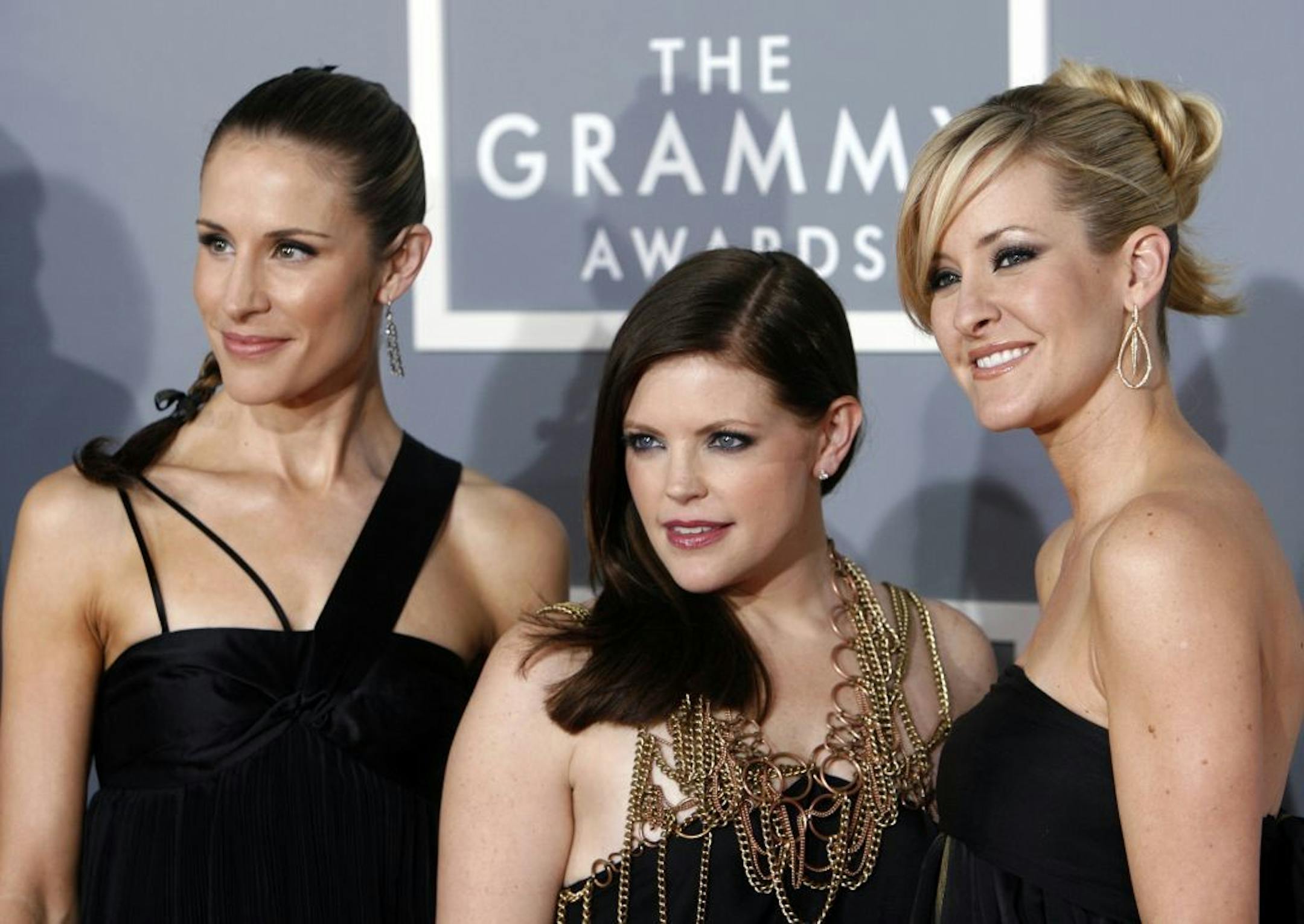 FILE - In this Feb. 11, 2007, file photo, the Dixie Chicks, Emily Robison, left, Natalie Maines, center, and Martie Maguire, who earned five Grammy nominations, arrive for the 49th Annual Grammy Awards in Los Angeles. The Dixie Chicks are ready to party in the USA with a summer 2016 tour. The Grammy-winning group will kick off its �DCX MMXVI World Tour� on June 1, 2016, in Cincinnati. It wraps in Los Angeles on Oct. 10, 2016. The group will visit more than 40 cities, including New York, Chicago,