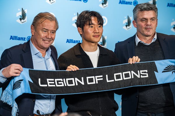 Loons coach Adrian Heath, left, and technical director Mark Watson introduced the newly signed Sang Bin Jeong on Wednesday at Allianz Field.