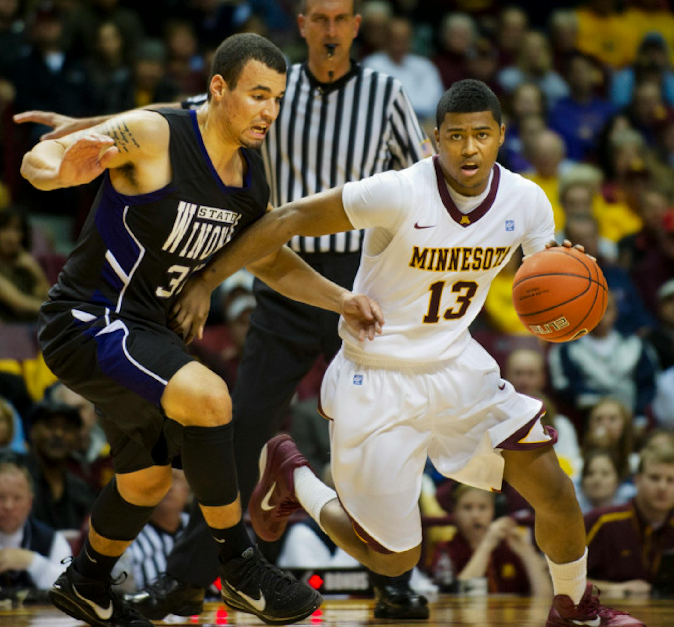 DAVID BREWSTER ¥ dbrewster@startribune.com       Sunday  11/08/10  Minneapolis GOPHER MEN'S  BASKETBALL - MINNESOTA vs. WINONA STATE  -- SECOND HALF  ]       Gopher Maverick Ahanmisi drives by Winona State Anthony Tucker.