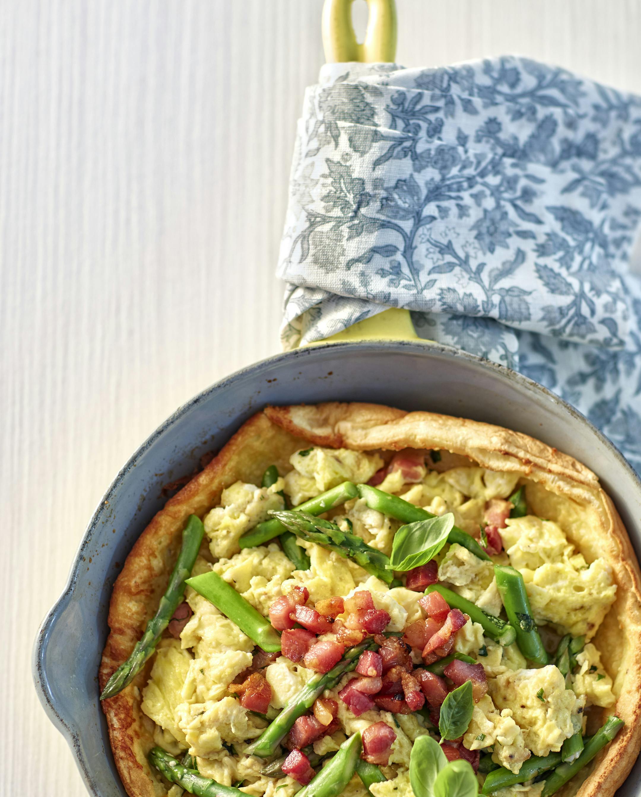 Dennis Becker
Asparagus Basil Scrambled Eggs in Parmesan Dutch Baby With Crispy Pancetta.