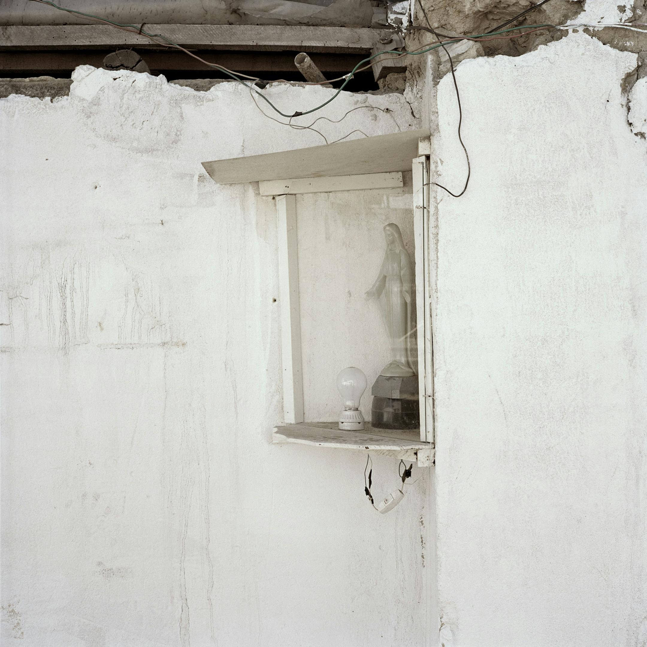 A lightbulb-lit shrine to the Virgin Mary in Alec Soth's "Dog Days Bogotá." Books such as this have helped elevate the Minneapolis artist to international fame.