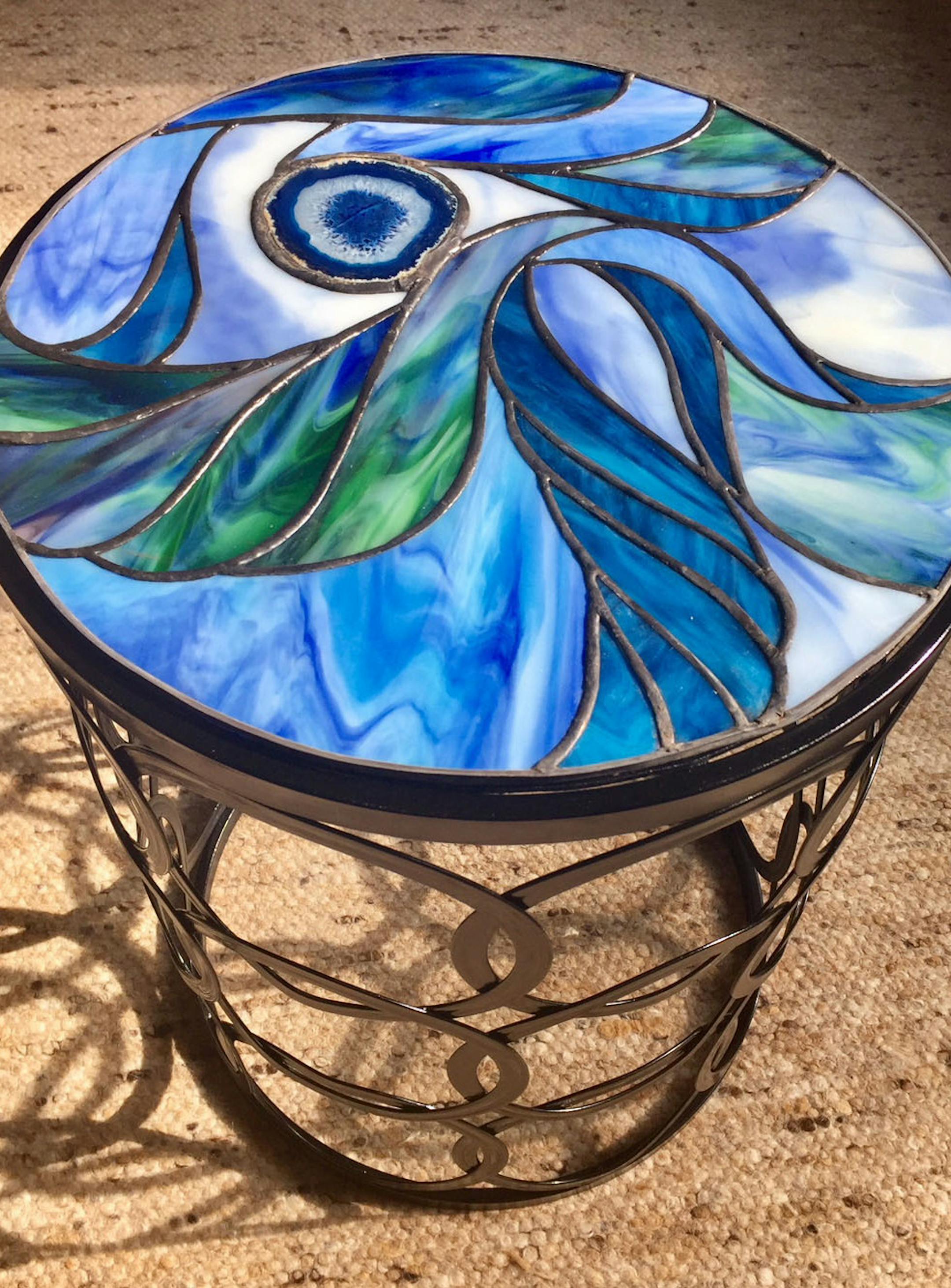 Glass-top table by artist Steve King