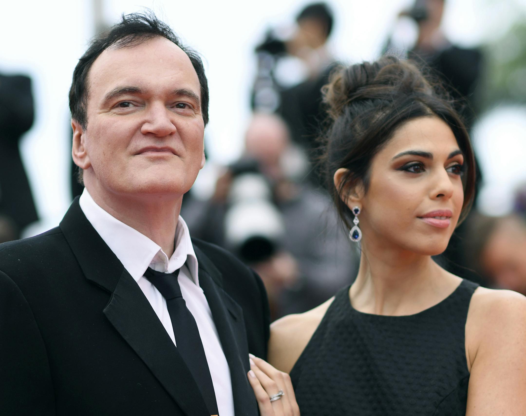 FILE - In this May 18, 2019 file photo, film director Quentin Tarantino and his wife Daniela Pick pose for photographers upon arrival at the premiere of the film "The Wild Goose Lake" at the 72nd international film festival, Cannes, southern France. Tarantino is about to become a father. His representative Katherine Rowe says the “Once Upon a Time... In Hollywood” director and his wife, Israeli model and singer Pick, are expecting a baby. The couple met in 2009 and married last Nov