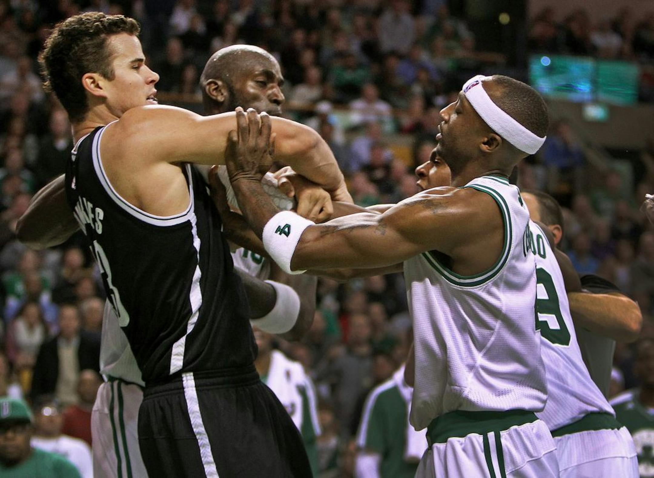 Boston Celtics Kevin Garnett, rear center, Rajon Rondo, rear right, and Jason Terry (4) clash with Brooklyn Nets Kris Humphries, left, during an NBA basketball game on Wednesday, Nov. 28, 2012, in Boston.