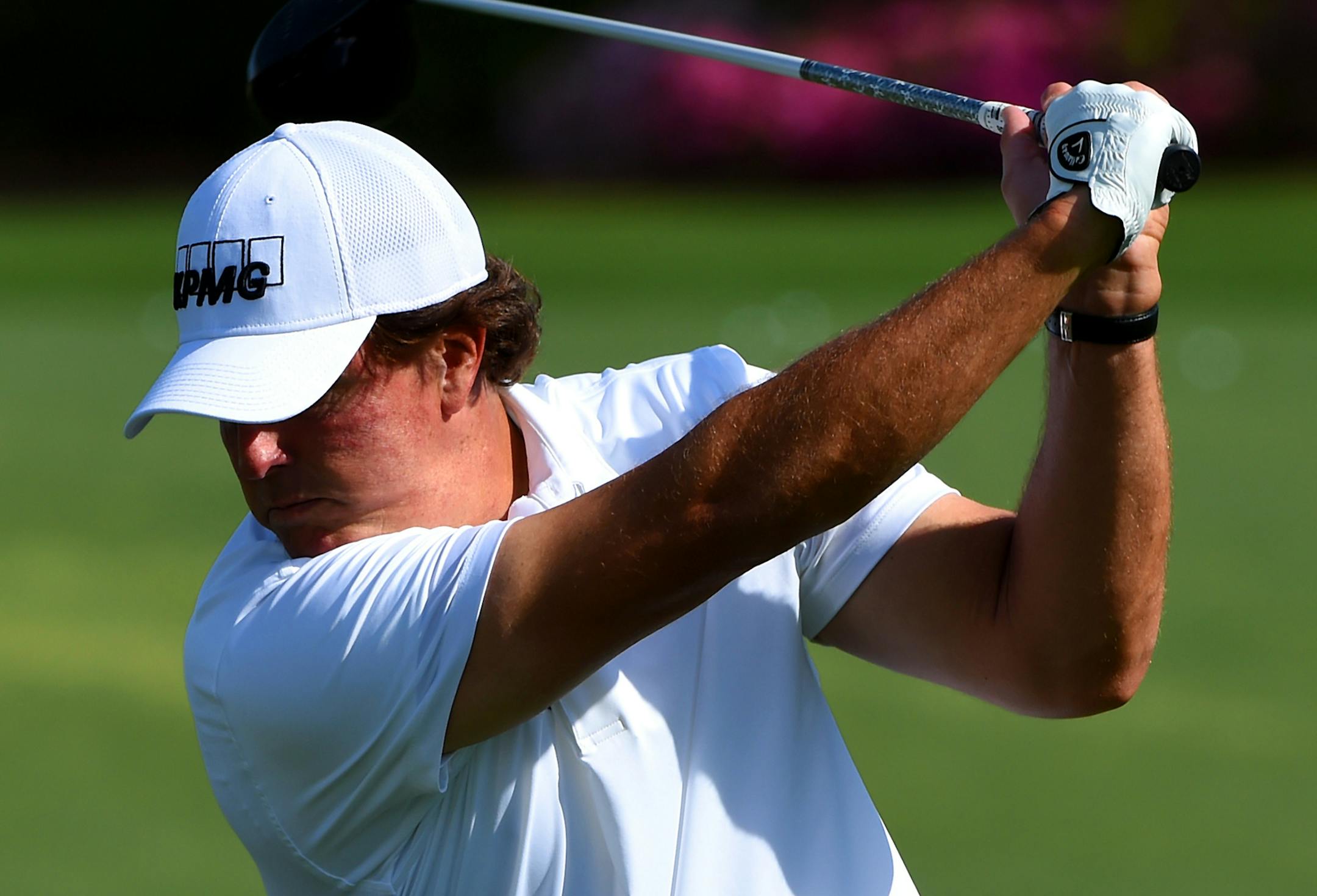 Phil Mickelson concentrates on his follow through as he practices on Wednesday, April 6, 2016, at Augusta National Golf Club in Augusta, Ga. First round action of The Masters tournament begins on Thursday. (Jeff Siner/Charlotte Observer/TNS)