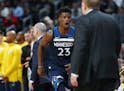 Timberwolves guard Jimmy Butler (23) runs back to the bench and head coach Tom Thibodeau during a game in December.