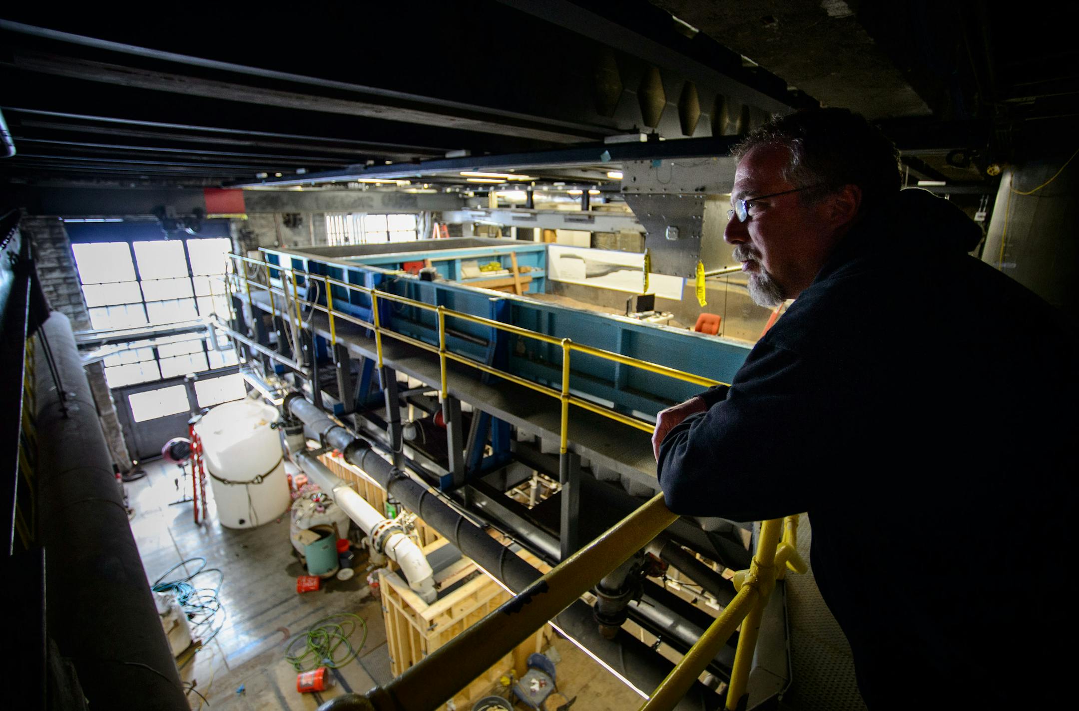 Ben Erickson researcher at the St. Anthony Falls Lab looked over an experiment that is designed to simulate the slow sinking of New Orleans. ] GLEN STUBBE * gstubbe@startribune.com Friday, March 14, 2014. The St. Anthony Falls Lab has built and repaired a lot of their own lab equipment and tech for other labs, and a researcher there, Chris Ellis, believes you don't need a lot of money or fancy tech to do good research.