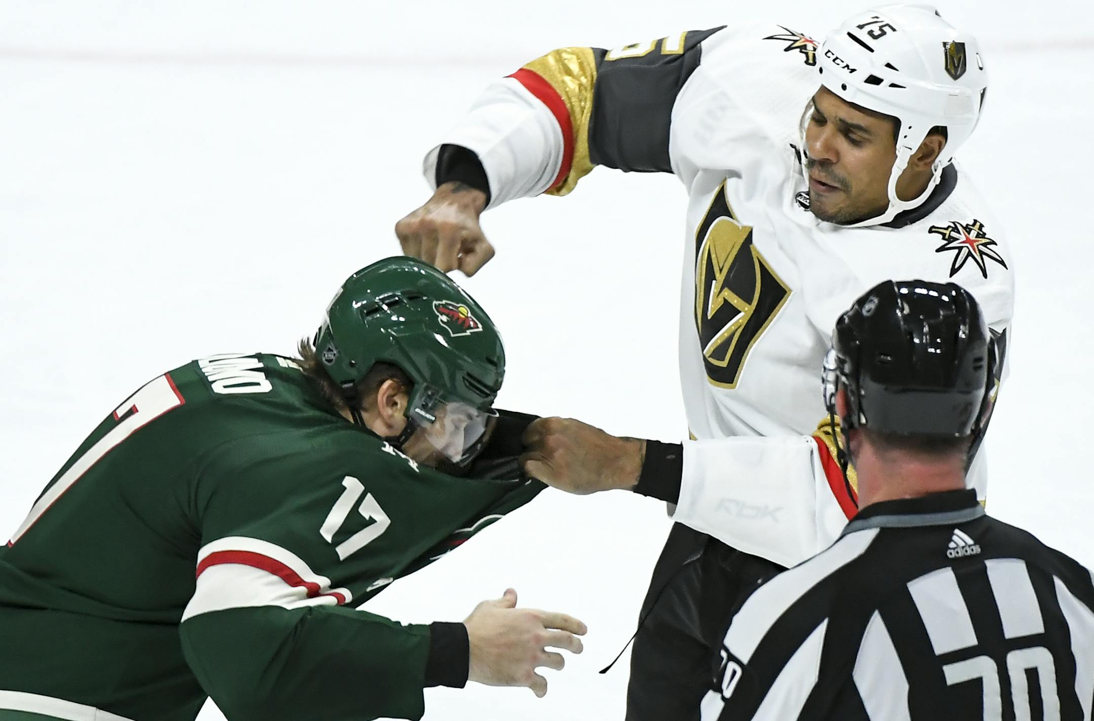 Vegas Golden Knights right wing Ryan Reaves (75) and Minnesota Wild left wing Marcus Foligno (17) fought in the third period Saturday night. ] AARON LAVINSKY &#x2022; aaron.lavinsky@startribune.com The Minnesota Wild played the Vegas Golden nights on Saturday, Oct. 6, 2018 at the Xcel Energy Center in St. Paul, Minn.