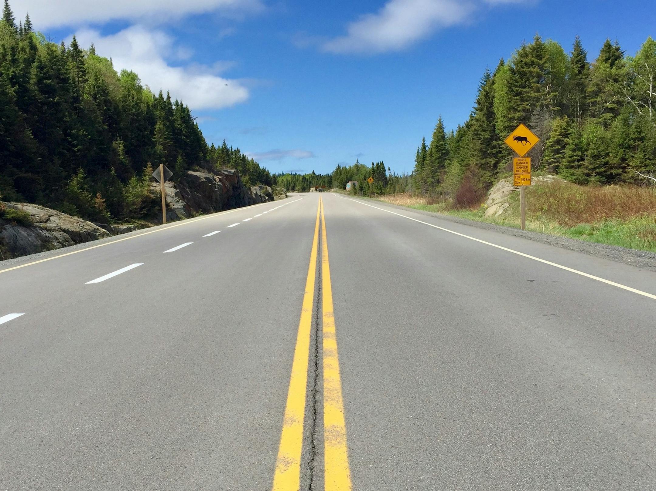 The 1,300-mile Lake Superior Circle Tour loops around the largest of the Great Lakes, through Minnesota, Ontario, Michigan and Wisconsin. On many remote Ontario roads like this, signs warn motorists of the danger of hitting moose.