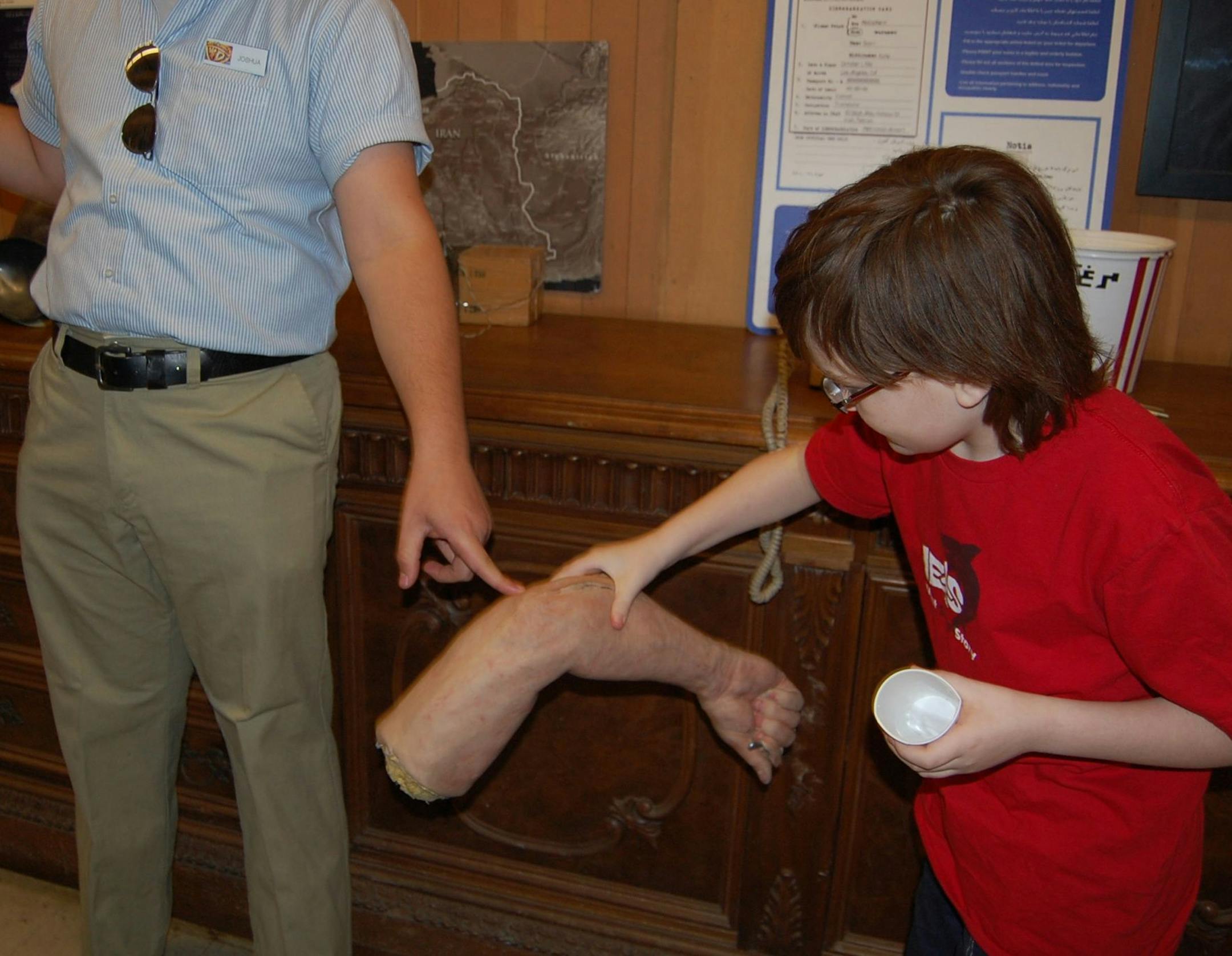 Ryan Muschler holds a fake arm, one of more than 200,000 props at Warner Bros. studios famous props department.