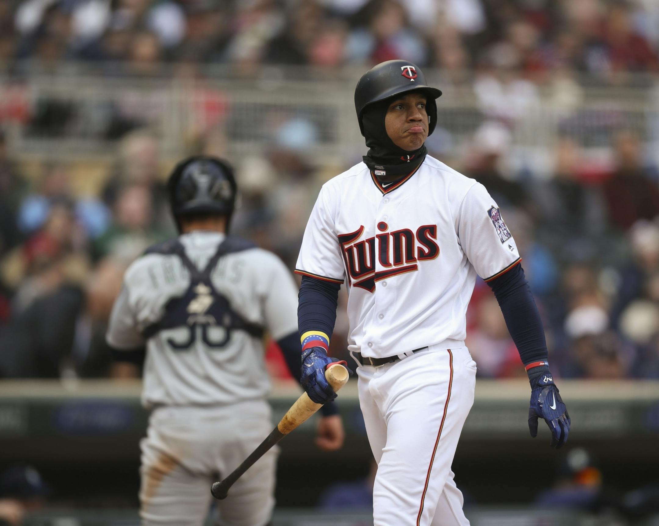 Minnesota Twins shortstop Ehire Adrianza wore a frown after striking out to end the second inning.