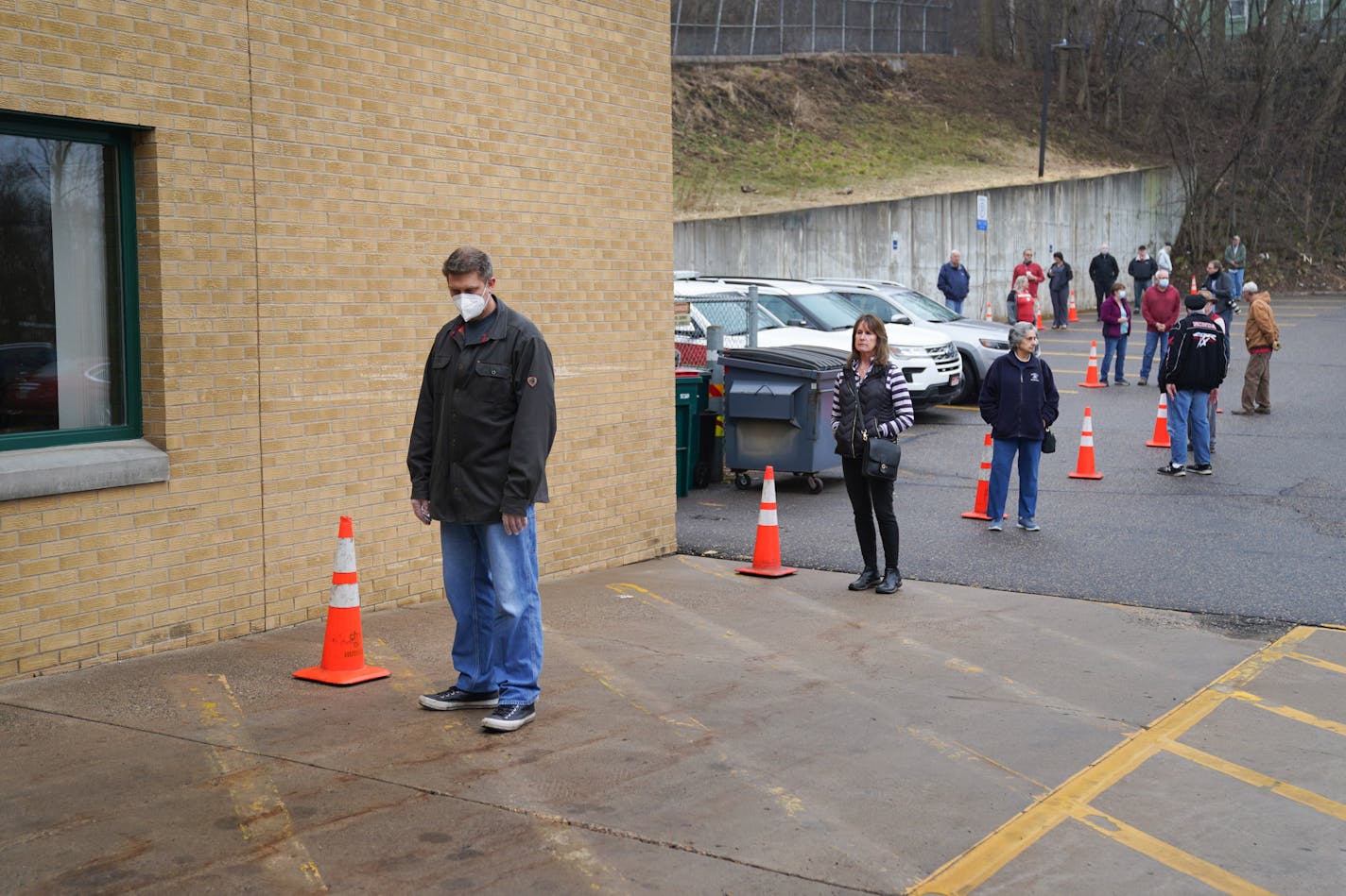 Voters in Hudson, Wisconsin were allowed into the firehouse one by one to vote in Tuesday's primary. They lined up next to cones in the parking lot that were ten feet apart. They started at a hand washing station and voting equipment was sanitized after each voter.