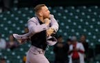MMA fighter Conor McGregor throws out a ceremonial first pitch before a baseball game between the Chicago Cubs and the Minnesota Twins Tuesday, Sept. 