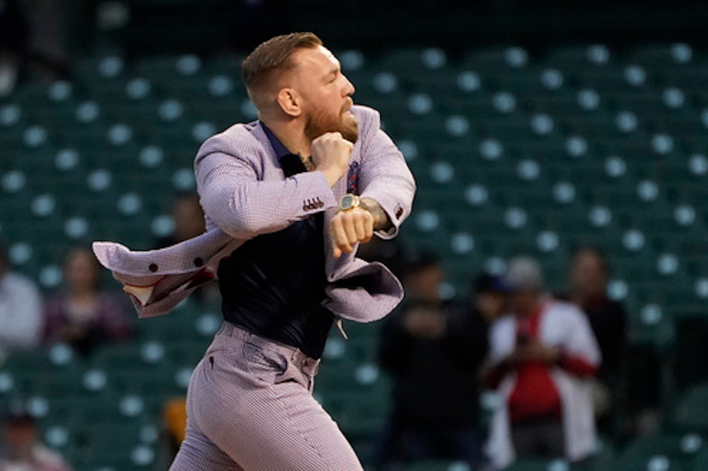 MMA fighter Conor McGregor throws out a ceremonial first pitch before a baseball game between the Chicago Cubs and the Minnesota Twins Tuesday, Sept. 21, 2021, in Chicago. (AP Photo/Charles Rex Arbogast)