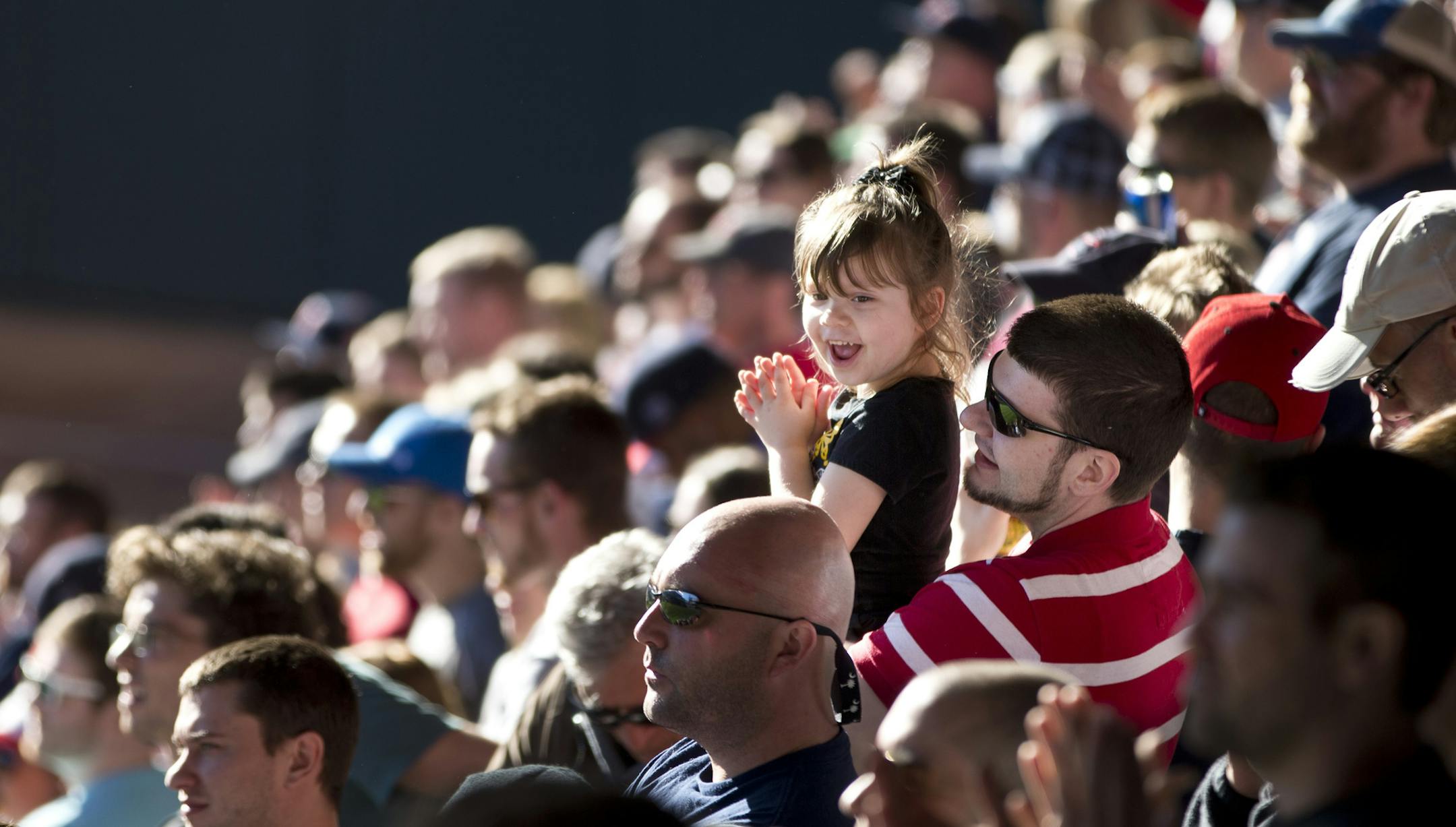 Kenny Beck of Brooklyn Center held his niece Abbigale Lashuay during the seventh inning stretch of the Twins vs. Oakland home opener at Target Field in Minneapolis, Minn., on Monday, April 7, 2014. (RENEE JONES SCHNEIDER • reneejones@startribune.com) Abbigale lashuay CQ