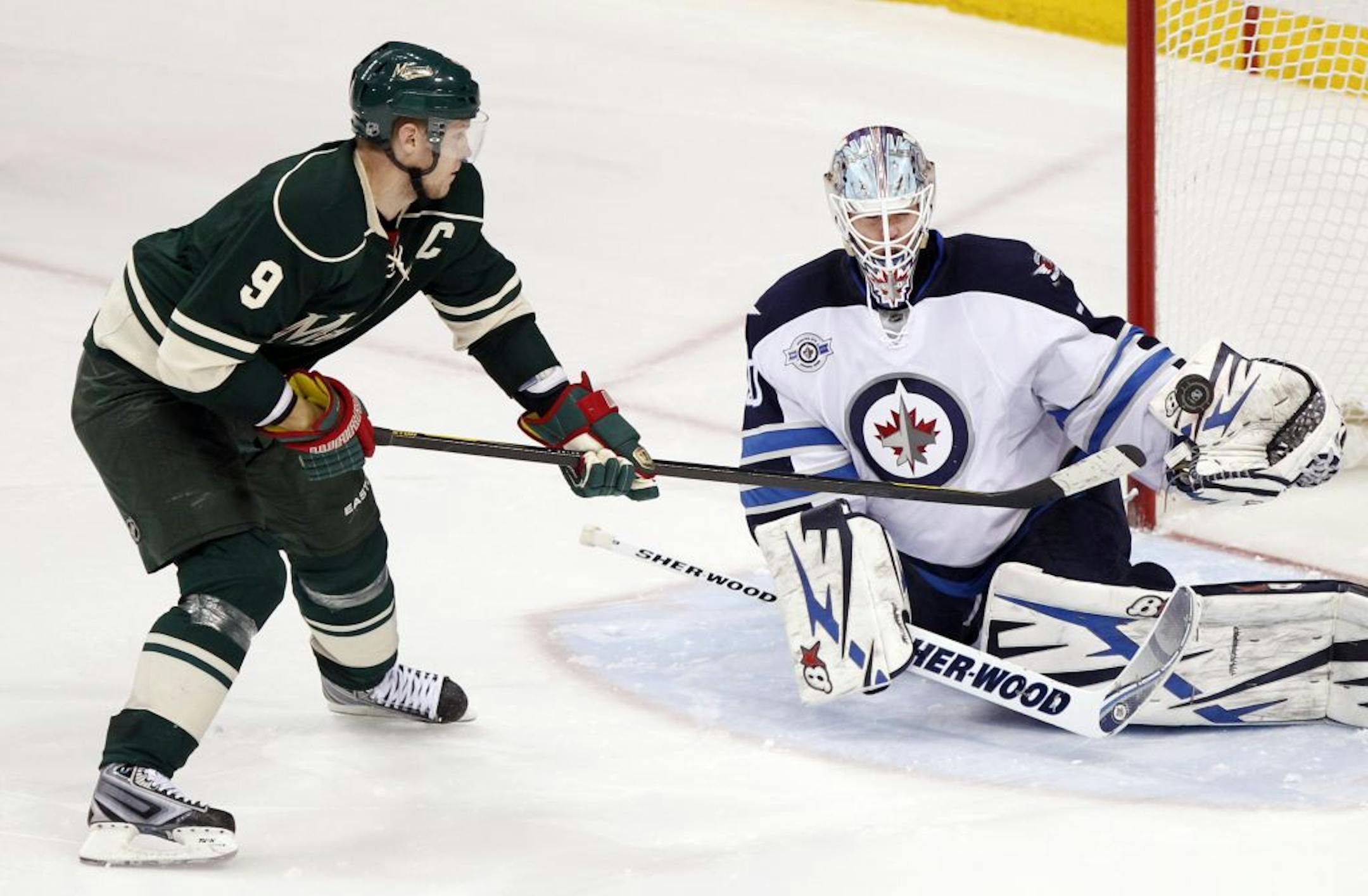 Wild forward Mikko Koivu (9)