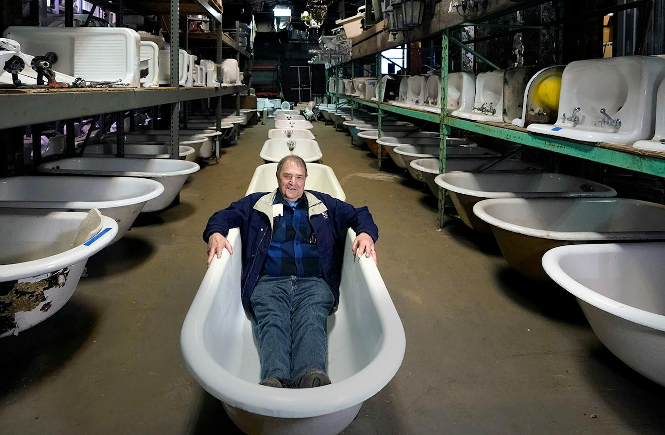 Russell Bauer, owner of Bauer Brothers Salvage, sits in one of the many antique claw foot tubs in their massive warehouse in N. Minneapolis. Bauer Brothers is a company dedicated to protecting historical and rare items hoping to provide them with a second chance at life. A way to prove their high quality worth, and a chance to let their story continue.