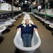 Russell Bauer, owner of Bauer Brothers Salvage, sits in one of the many antique claw foot tubs in their massive warehouse in N. Minneapolis. Bauer Bro