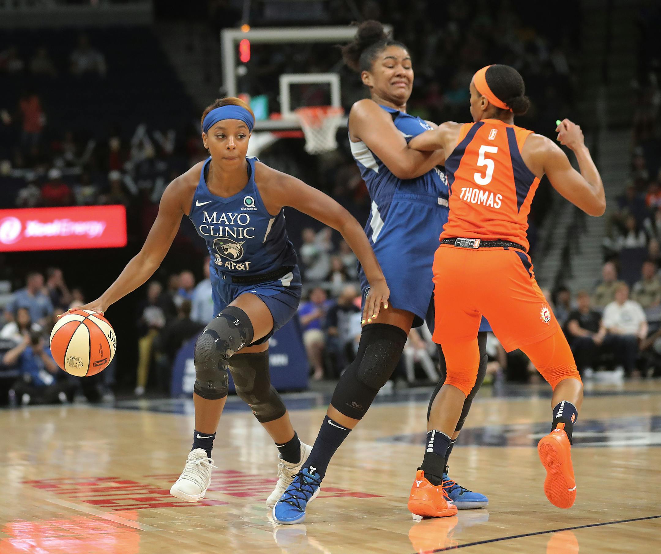 The Minnesota Lynx's Lexie Brown (1) dribbles around a pick set by teammate Damiris Dantas (92) on the Connecticut Sun's Jasmine Thomas (5) during the first half Friday, June 14, 2019, at the Target Center in Minneapolis, MN.] DAVID JOLES • david.joles@startribune.com Connecticut Sun at Minnesota Lynx at Target Center