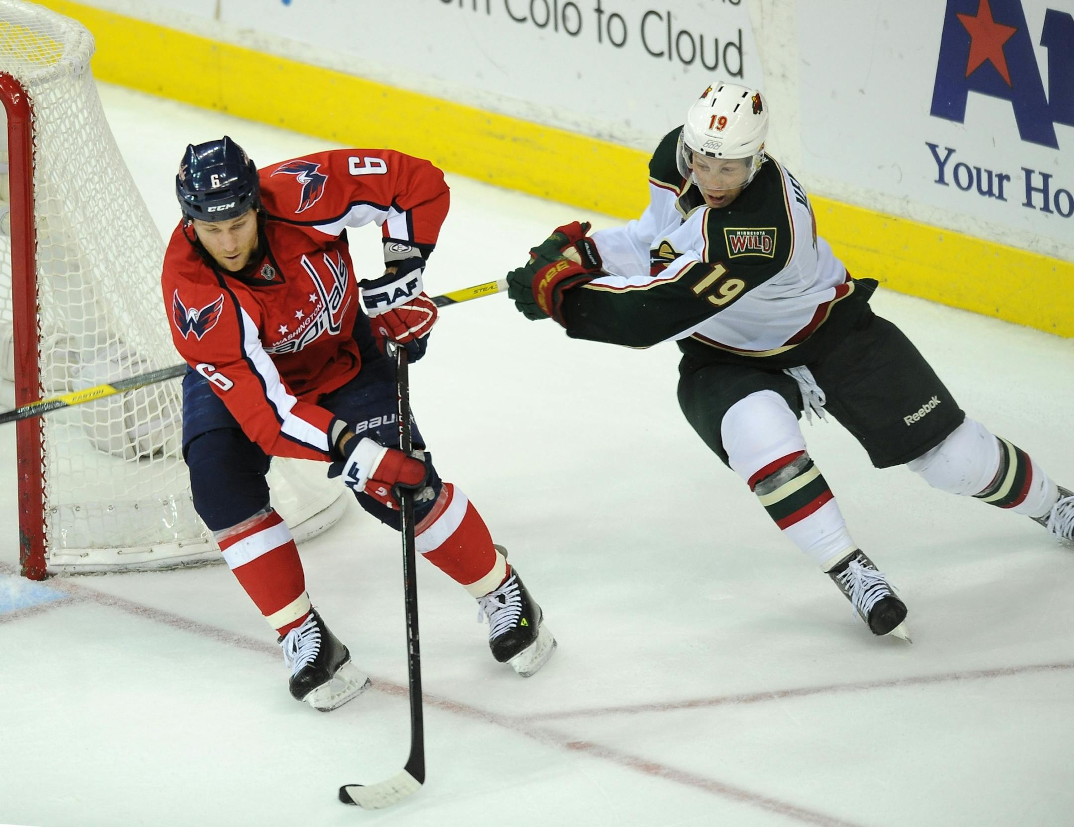 The Calgary Flames traded for and signed Capitals defenseman Dennis Wideman (left) to a five-year deal Wednesday.