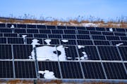 Bits of snow covered panels at a solar garden Winona subscribes to on Burns Valley Road in La Crescent.