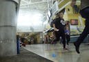 Passengers run for cover in Terminal 1 at Fort Lauderdale-Hollywood International Airport on Friday in Fort Lauderdale, Fla.