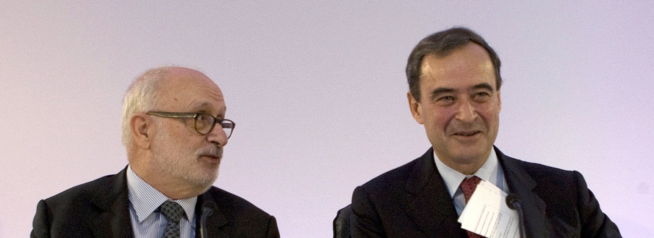 Rolf Soiron, chairman of Holcim Ltd., left, looks towards Bruno Lafont, chief executive officer of Lafarge SA, as he addresses the media during a news conference in Paris, France, on Monday, April 7, 2014. Holcim and Lafarge agreed a merger to create the world's biggest cement maker with more than $40 billion in sales and cut overcapacities and energy expenses. Photographer: Ivan Guilbert/Bloomberg *** Local Caption *** Rolf Soiron; Bruno Lafont ORG XMIT: 483548715