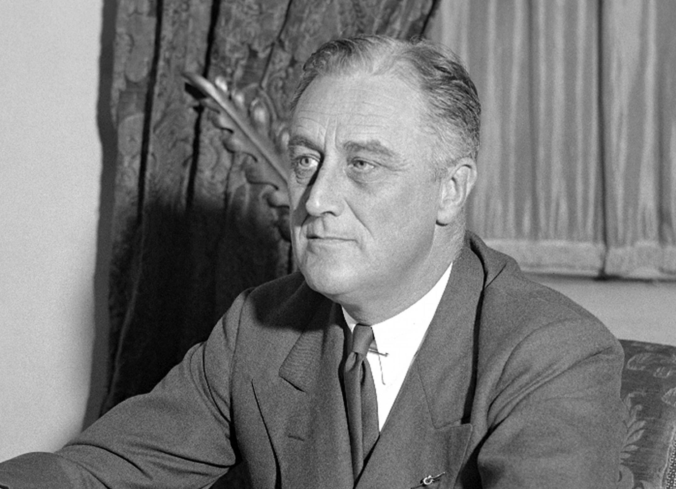 FILE - In this May 7, 1933, file photo, President Franklin D. Roosevelt is shown at his desk at the White House, in Washington, when he outlined his ideas to the nation on a partnership between the government and agriculture, industry, and transportation. He announced measures to be proposed soon to give industrial workers a better deal. A president’s first 100 days can be a tire-squealing roar from the starting line, a triumph of style over substance, a taste of what’s to come or
