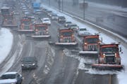 Snow plows teamed up to clear snow from the west bound lanes of Interstate 94 near Burns Ave. in St. Paul. ] (JIM GEHRZ/STAR TRIBUNE) / April 11, 2013