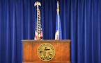 The Governor's podium with Minnesota State flag and state seal, state motto L'Étoile du Nord. ] GLEN STUBBE * gstubbe@startribune.com Tuesday, June 7