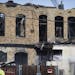 Fire fighters continued to to hose water on a fire that broke out on the 900 block of W Broadway in Minneapolis, Minn., on Wednesday, April 15, 2015.