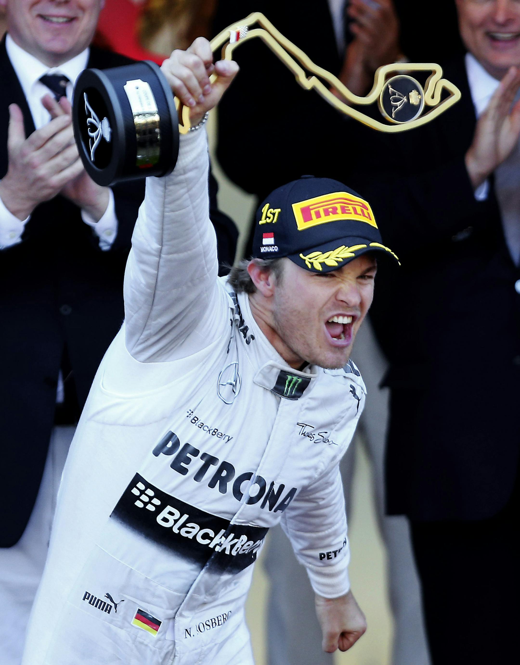 Mercedes driver Nico Rosberg, of Germany, celebrates on the podium after winning the Formula One Grand Prix at the Monaco racetrack, in Monaco, Sunday, May 26, 2013. (AP Photo/Antonio Calanni)