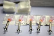 Doses of the Moderna COVID-19 vaccine. (Brad Horrigan/The Hartford Courant/TNS) ORG XMIT: 24099585W