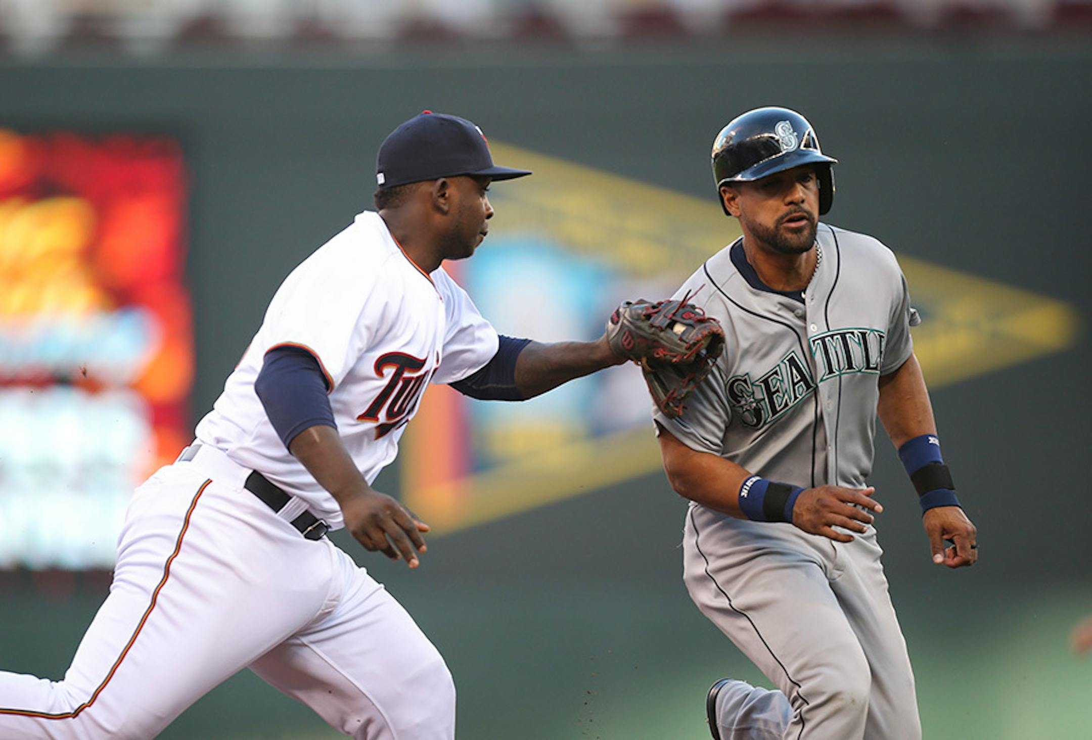Minnesota Twins third baseman Miguel Sano tagged out Mariners' designated hitter Franklin Gutierrez.