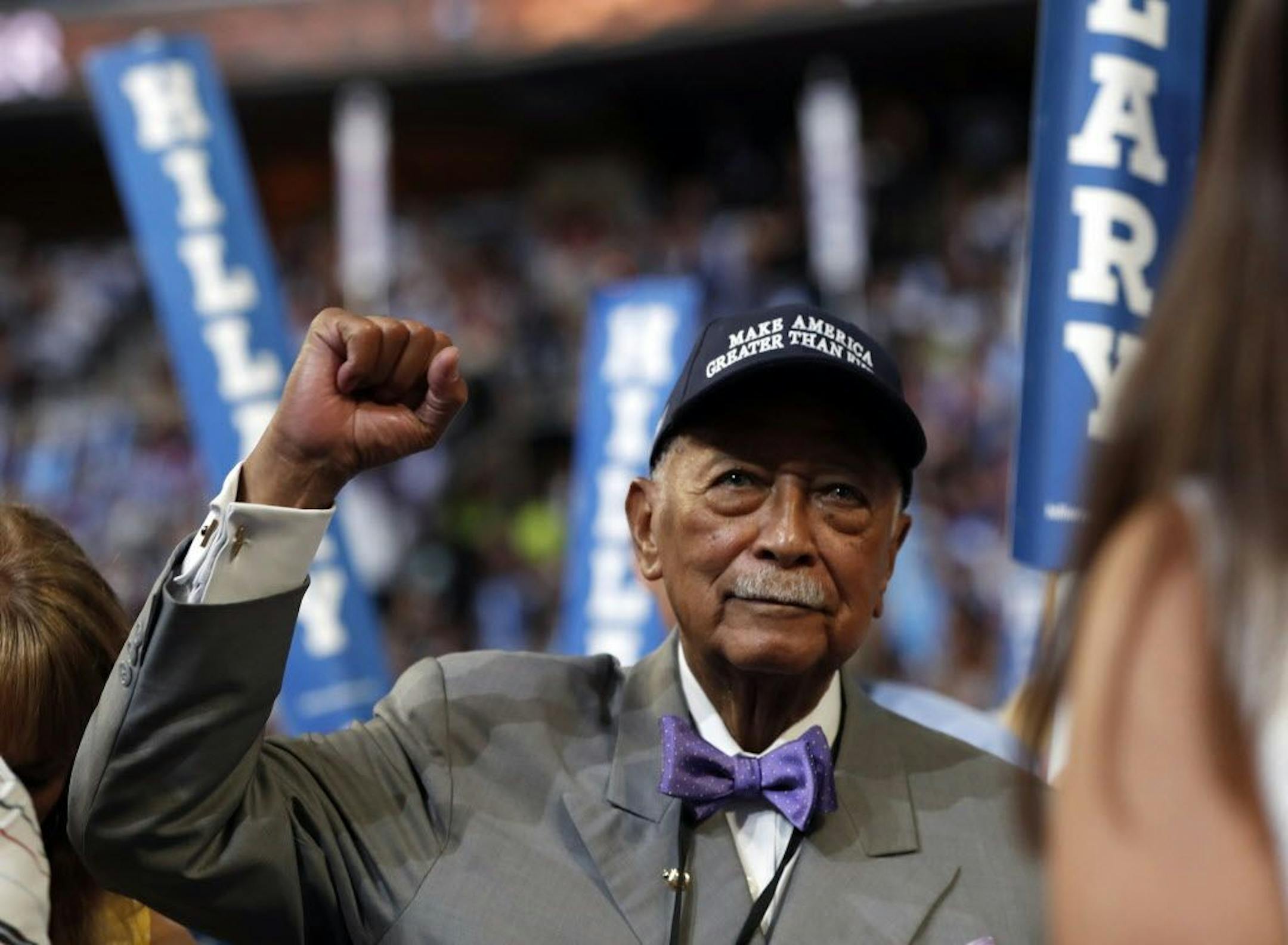 Former New York City Mayor David Dinkins raises his fist during the final day of the Democratic National Convention in Philadelphia, Thursday, July 28, 2016.