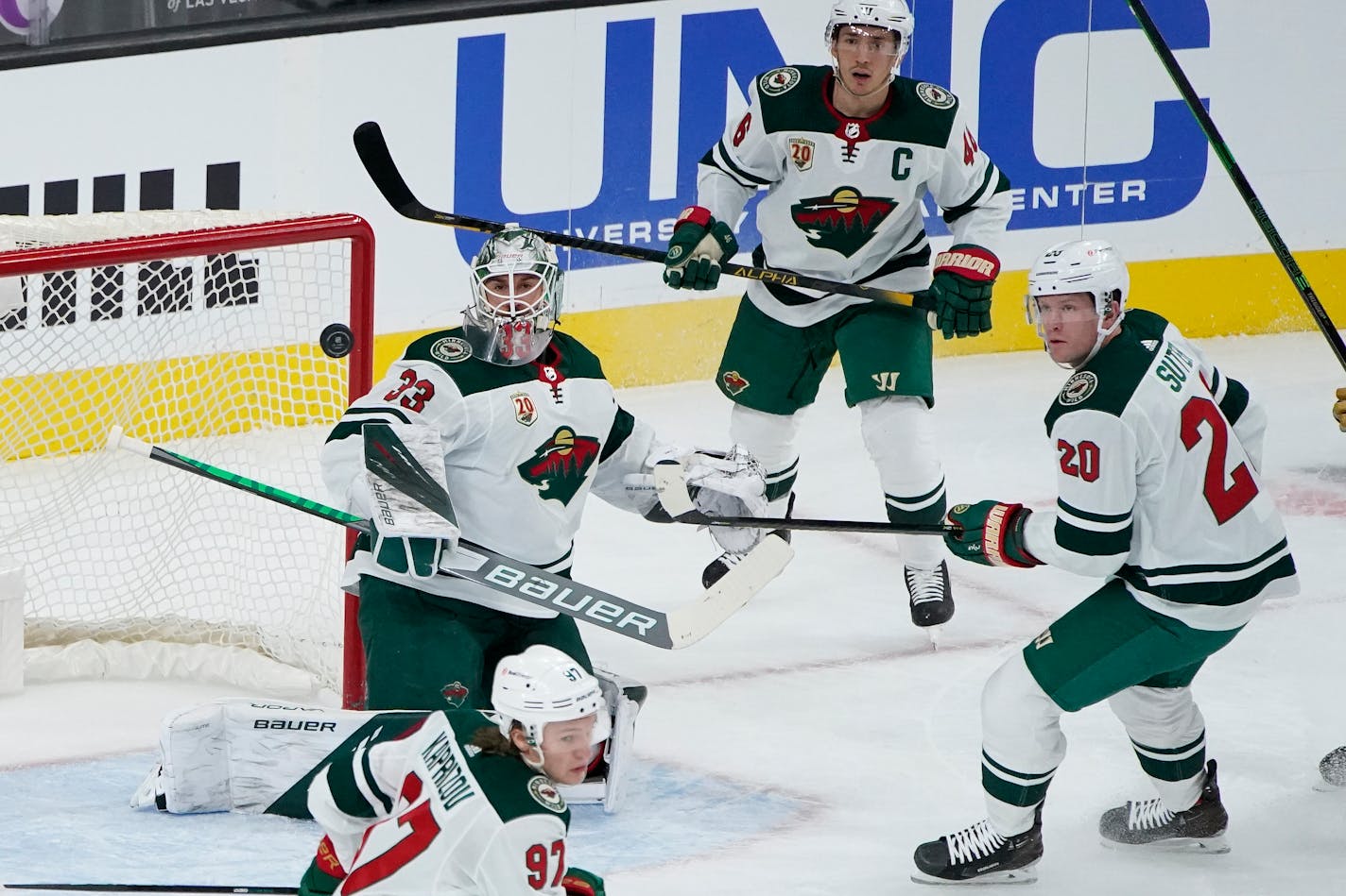 Minnesota Wild goaltender Cam Talbot (33) blocks a shot by the Vegas Golden Knights during the first period of an NHL hockey game Thursday, April 1, 2021, in Las Vegas. (AP Photo/John Locher)