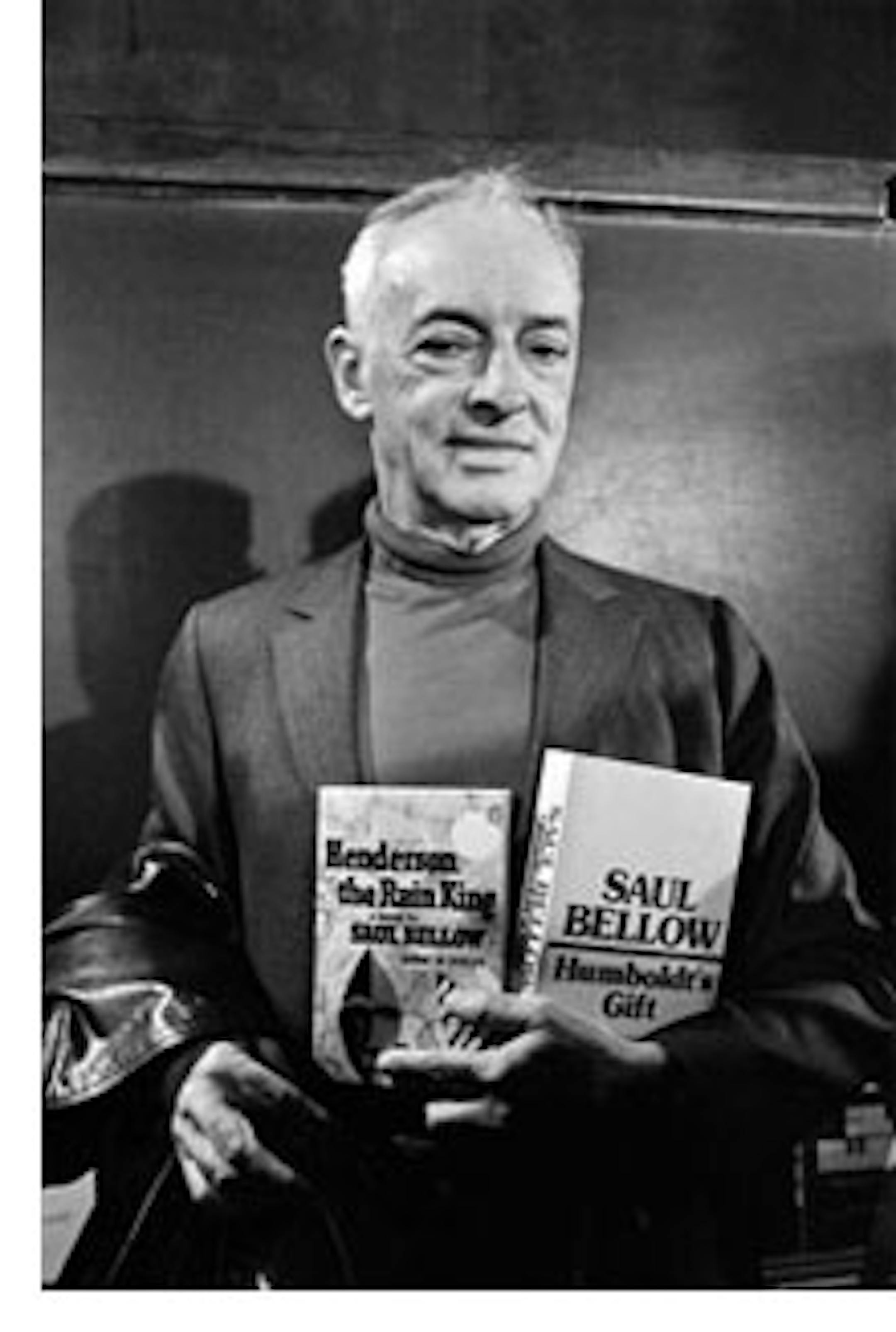 Novelist Saul Bellow, who was awarded a Nobel Prize in Literature, clutches two of his books as he appears at a press conference at the University of Chicago Oct. 21, 1976.  Bellow came to the University of Chicago in 1963 to join the English Department and the Committee on Social Thought.   Bellow was the fifth American to receive the Nobel award in 1976, an unprecedented clean sweep.  Bellow is holding his books, "Henderson the Rain King" of 1959, and "Humboldt's Gift" of 1975.     (AP Photo/ Charles Knoblock)