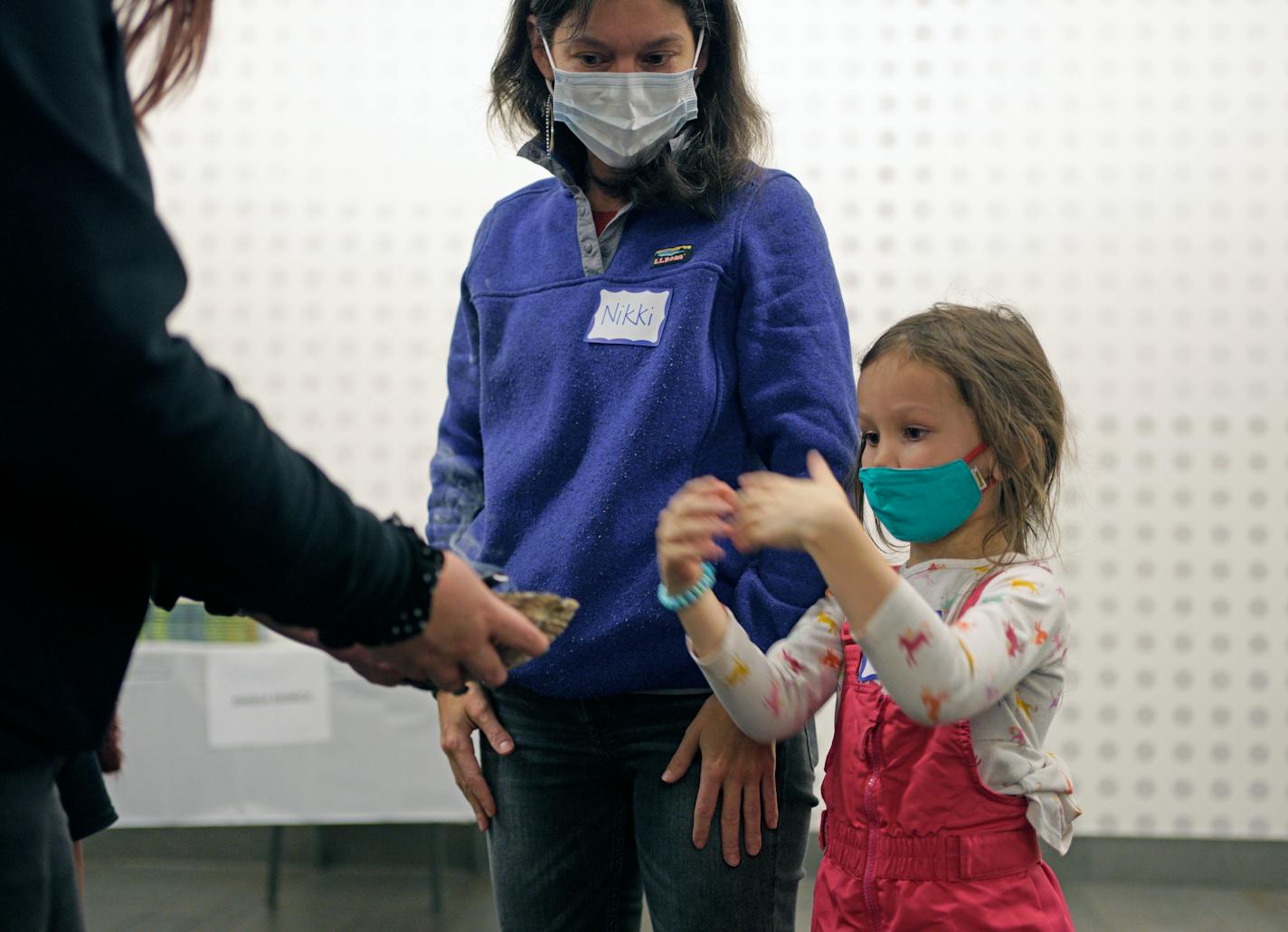 5-year-old Annora Harralson and her mother Nikki Farago participated in welcome Smudge before Wednesday nights American Indian Awareness activities at the Davis Center in North Minneapolis. Minneapolis Public Schools held several events as part of American Indian Awareness and Family Involvement Week. Native American Smudging is a ritualistic burning of herbs and plants to purify and cleanse negative energy, bring good luck, and protect a person or place. Wednesday, Nov. 17, 2021 Minneapolis, Minn. ] Brian Peterson ¥ brian.peterson@startribune.com