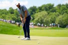Scottie Scheffler reacts after missing a putt on the fourth hole during the final round of the PGA Championship golf tournament at the Valhalla Golf C
