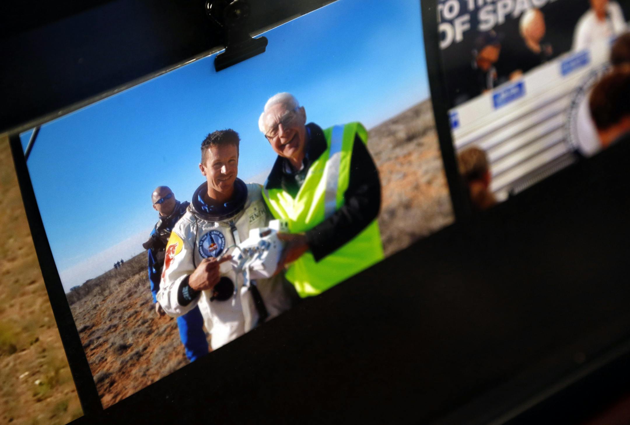 A photo on Brian Utley's desk with Felix Baumgartner taken after his record breaking skydiving jump. Utley has worked with computers for 40 decades, but his real love is less grounded: aviation. A member of the Minnesota Soaring Hall of Fame, he spends a lot of his time monitoring and verifying world aviation records.] CARLOS GONZALEZ cgonzalez@startribune.com April 29, 2013, Eden Prairie, Minn., He has worked with computers for 40 decades, but Brian Utley real love is less grounded: aviation. A