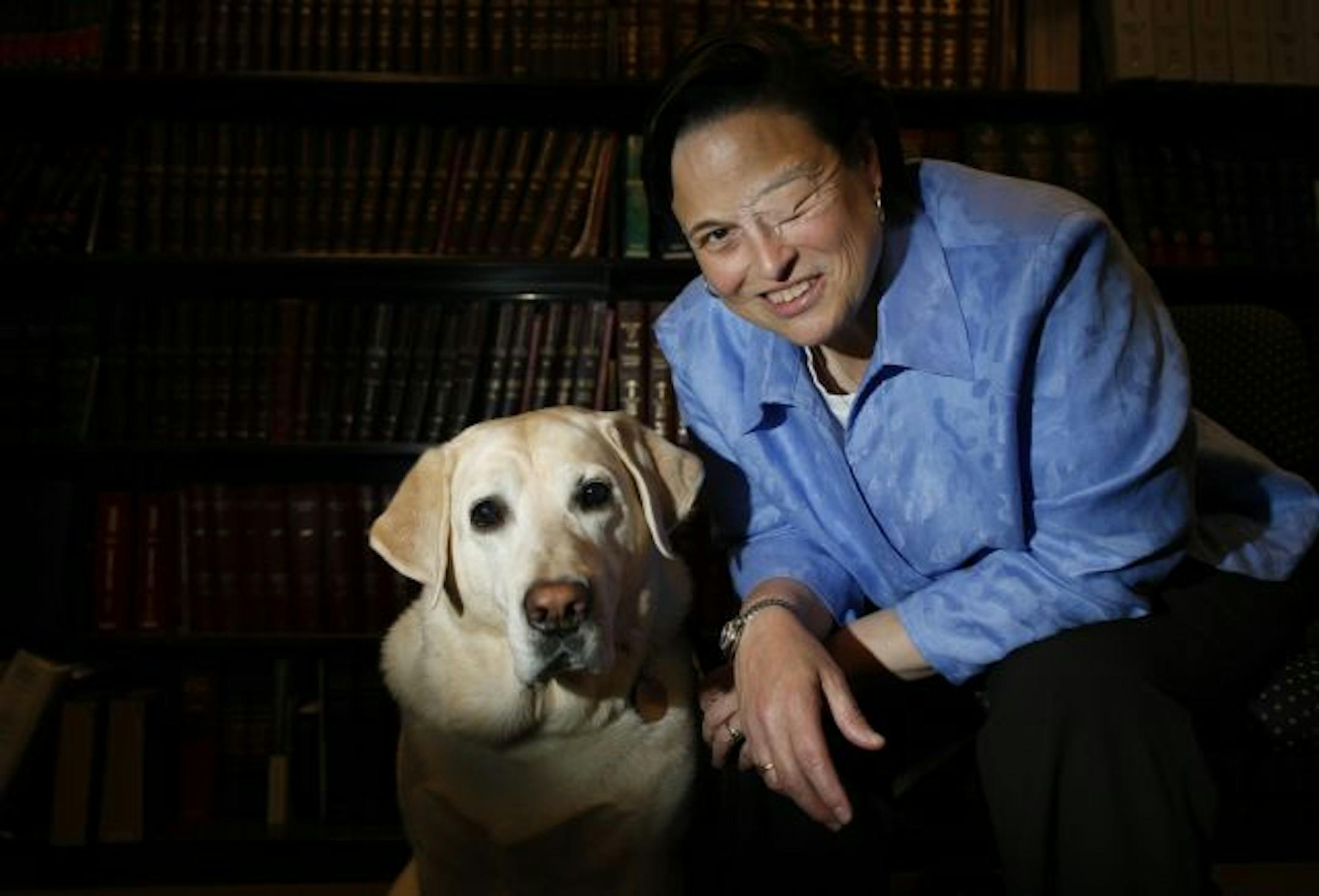 Deb Swenson and guide dog, Kudo, 6. "He takes his work very seriously and likes to be of service," said Swenson, who likens Kudo to a good lawyer.