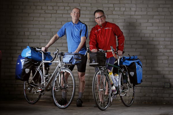 Will Fifer left and Tony Brown will ride there bicycles across America, they posed for a photo February 25, 2015 in Minneapolis.