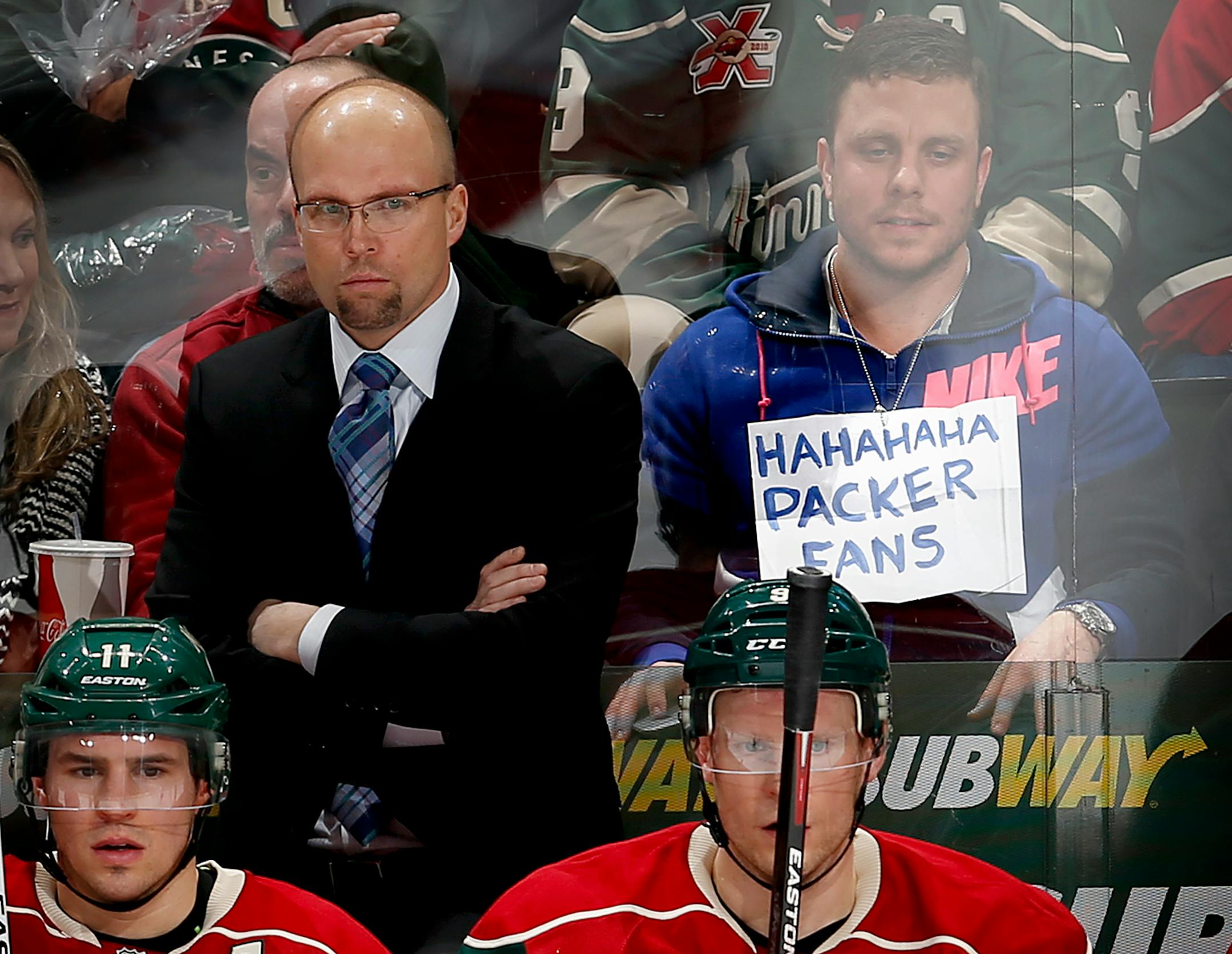 A fan seated behind the Wild bench poked fun at Green Bay Packers fans during Monday night's game at Xcel Energy Center. The Packers blew a 16-0 lead and lost to Seattle in overtime on Sunday in the NFC Championship Game.