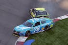 Martin Truex Jr. (78) was hit by Jimmie Johnson in the last lap of the NASCAR Cup series race at Charlotte Motor Speedway in Concord, N.C., on Sunday,