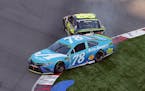 Martin Truex Jr. (78) was hit by Jimmie Johnson in the last lap of the NASCAR Cup series race at Charlotte Motor Speedway in Concord, N.C., on Sunday,