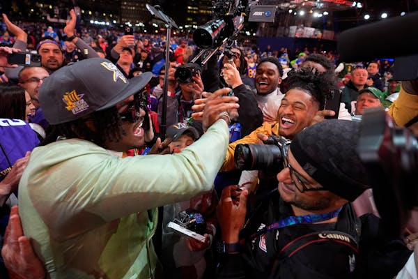Alabama linebacker Dallas Turner celebrates with fans after being chosen by the Minnesota Vikings with the 17th overall pick in the first round of the