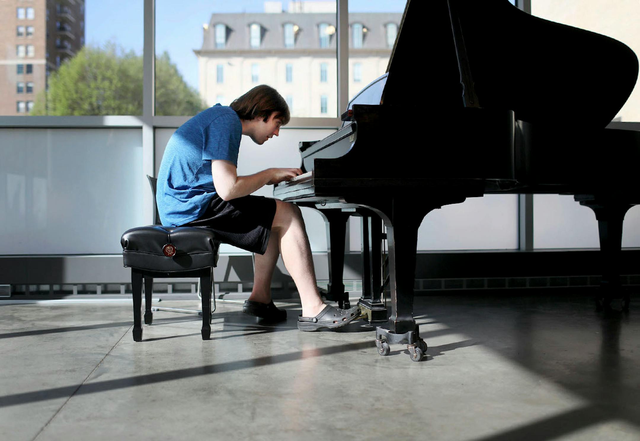 Alex Hagen, 21, has severe autism and limited speaking skills. But since he was a child, Hagen has displayed an amazing talent for playing the piano -- including a rare ability to play complicated classical pieces without reading the musical notes. With the help of state vocational counselors, Hagen is looking for work as a pianist. They have helped him develop a "video resume" of his musical work. Here, Hagen played piano during a lesson at MacPhail Center for Music Tuesday, May 15, 2018, in Mi